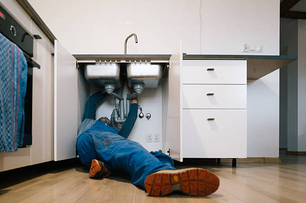 Professional Drain Cleaning technician working in Newark, NJ